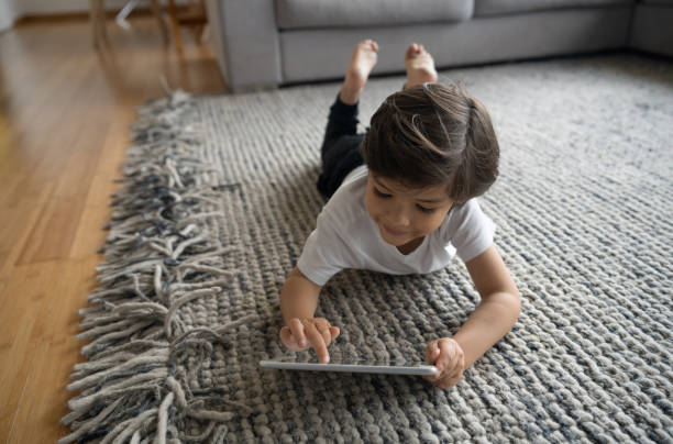 Girl lying on rug | Carpets by Direct